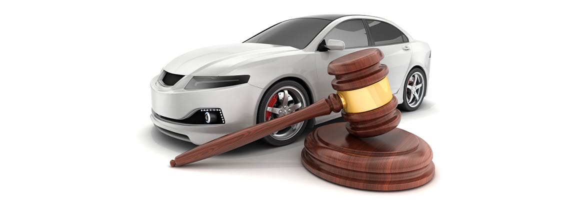 Picture of a car next to a gavel used in auctions