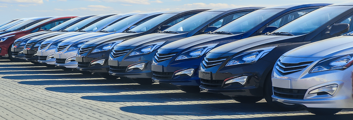 New cars lined up on a dealership lot