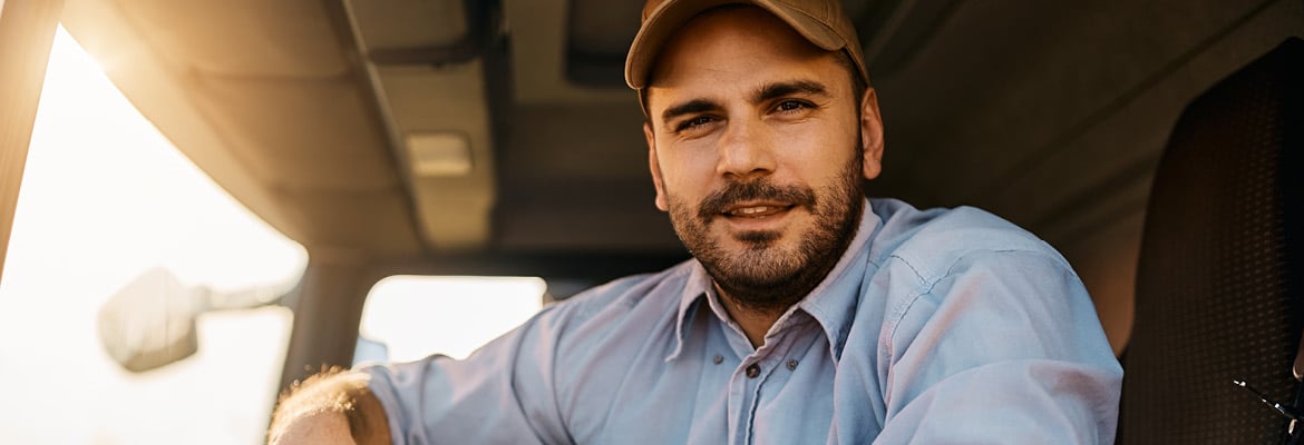 Close up of a truck driver sitting in his truck