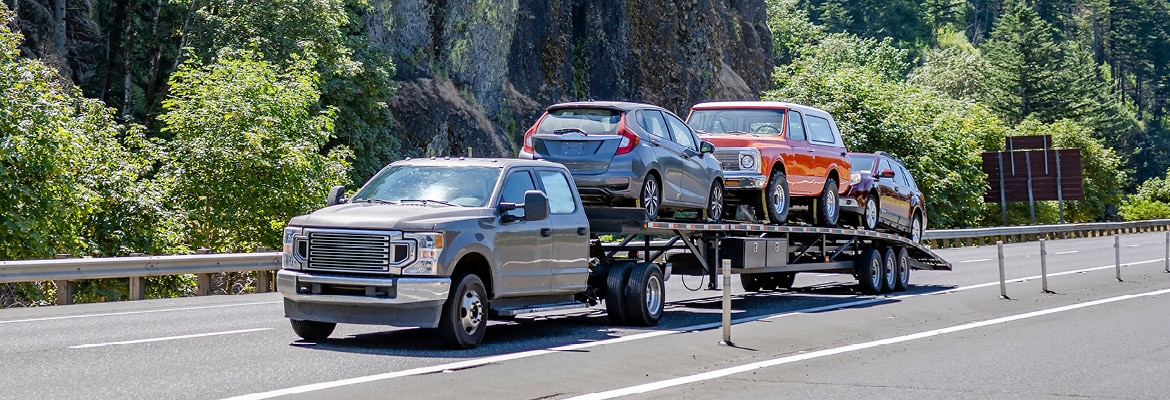 Hot shot car hauler truck transporting multiple cars