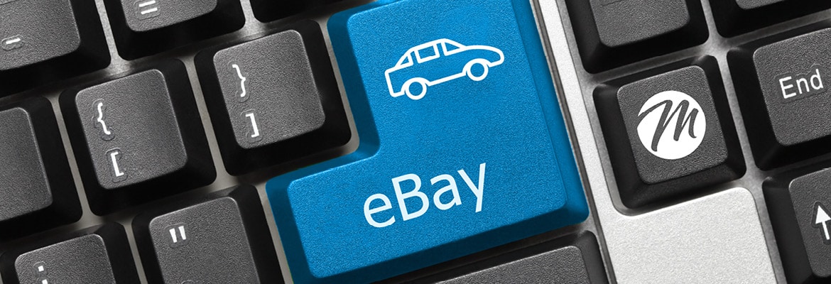 A computer key that says "eBay" with a car icon