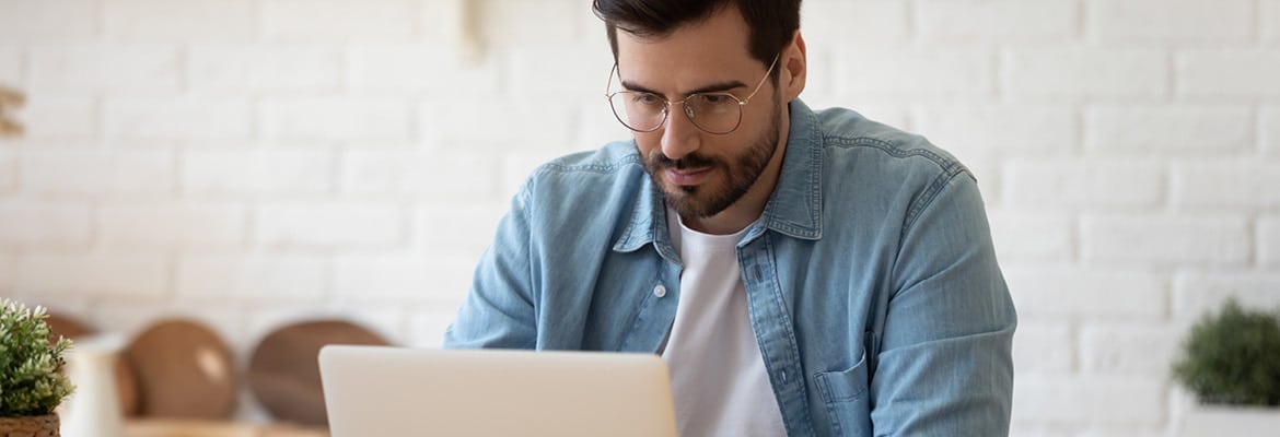 Man looking at his laptop