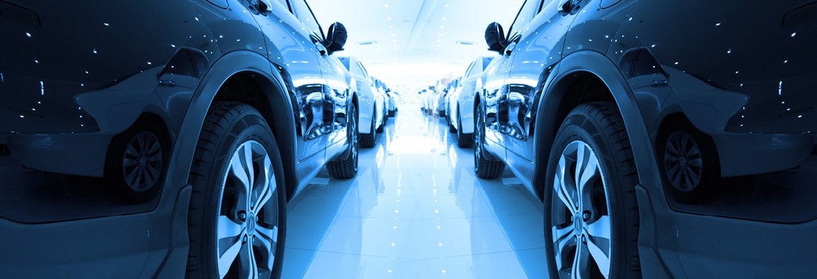 Rows of new cars at dealership successfully leveraging data.