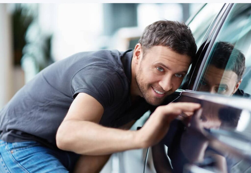 car-resellers-man-near-car-1024x707