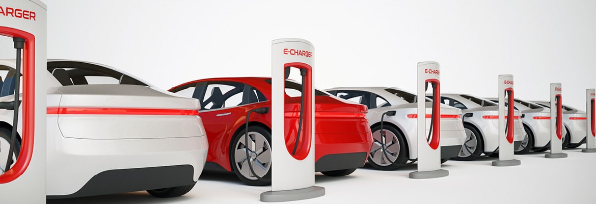 Row of electric vehicles charging.