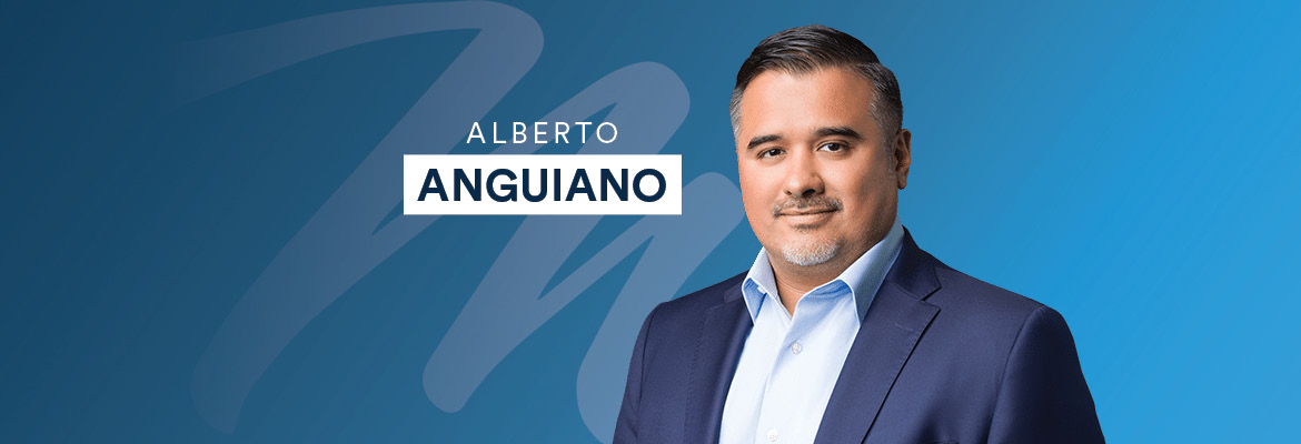 headshot of alberto anguiano on blue background