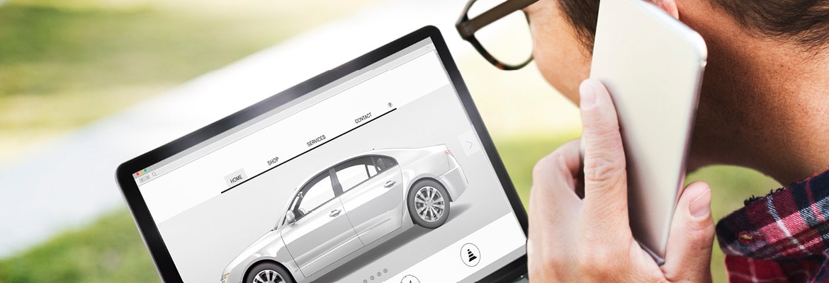 Man calling manufacturer to order new car.