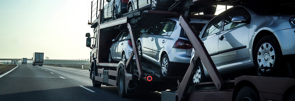 Types of trailers and trucks used for car shipping.