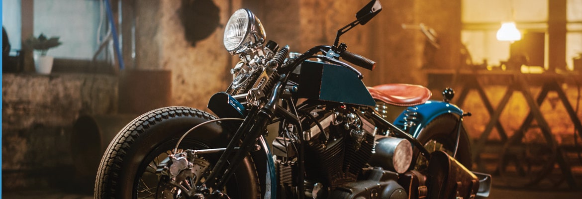 Vintage blue motorcycle donated to charity.