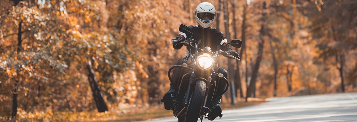 A man riding an electric motorcycle.